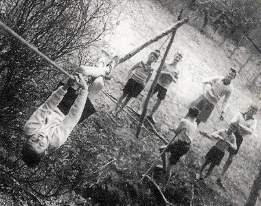 Gerard Davies on the rope watched by Mr Nigel Jee teachbng assistant and Scout troop leader. Spectators : Noble,Blake, Curry ? ? Photo Mr Colin Mansfield