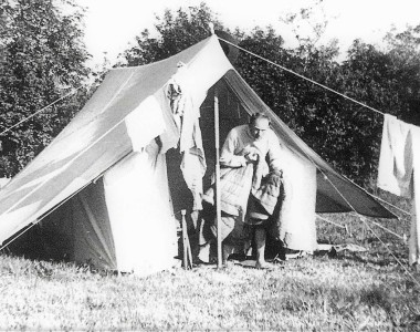 Major Todd Gamon, a teacher from Newells, emerges from his tent after staying at the camp for a night. Photo by Mr Colin Mansfield