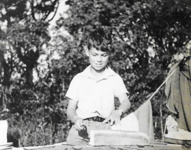 Reid Minor, cutting the bread .