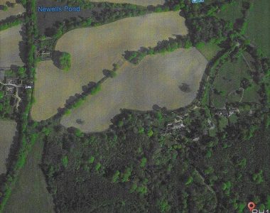 A broader landscape than the previous picture. You can see Newells pond clearly marked. The Scrase-Dickens Newells farm to the left and below the pond. The drive going down to the house from the Horsham road. The main path can be seen ( lower right ) that used to run across the front of the school and end at the farm.